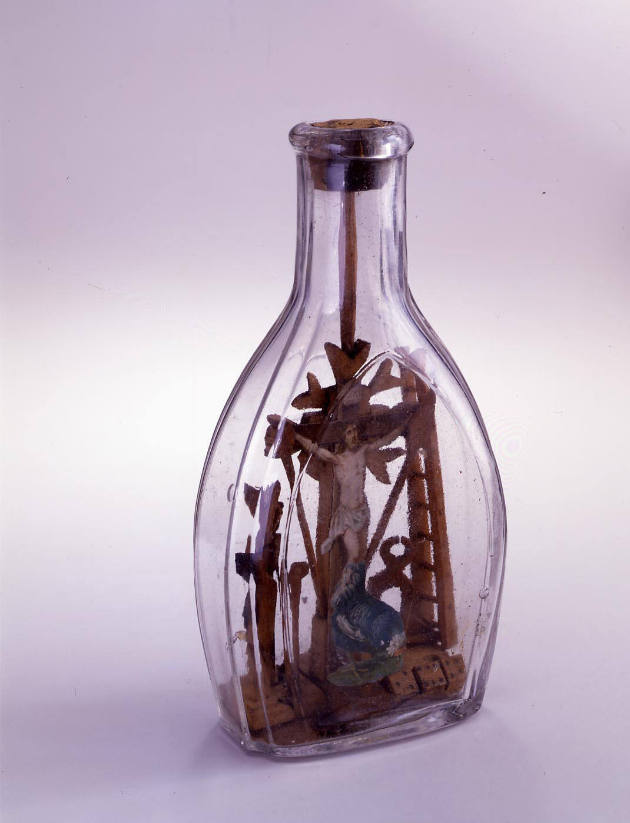 Artist unidentified, “Crucifixion”, Ohio, n.d., Glass, wood, paint on paper, cork stopper, 6 1/…