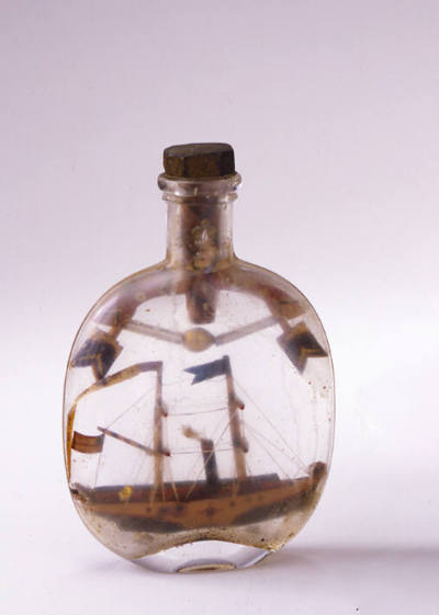Artist unidentified, “Ship”, United States, n.d., Glass, paint on wood, thread, metal, 5 3/4 × …