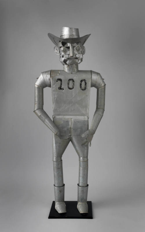 Rene LaTour, (b. 1905), “Tin Cowboy,” Ormond Beach, Florida, c. 1983, Tin, 72 × 29 × 20 in., Co…