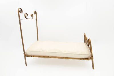 Artist unidentified, “Doll Bed”, United States, n.d., Metal with cotton mattress, 16 × 10 1/4 ×…