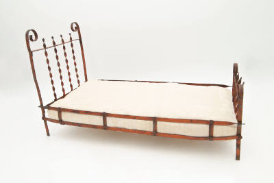 Artist unidentified, “Doll Bed”, United States, n.d., Metal with cotton mattress, 10 1/2 × 8 3/…