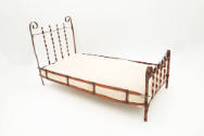 Artist unidentified, “Doll Bed”, United States, n.d., Metal with cotton mattress, 10 1/2 × 8 3/…