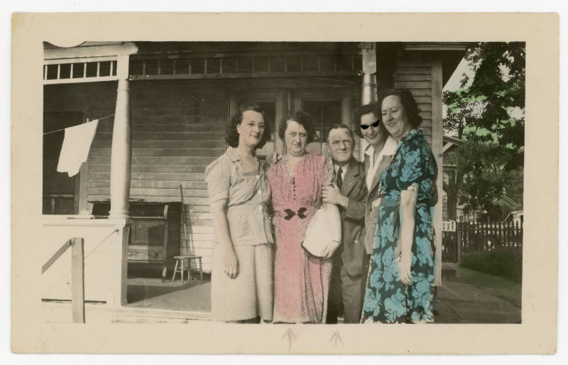 Untitled [Group portrait in front of a porch]