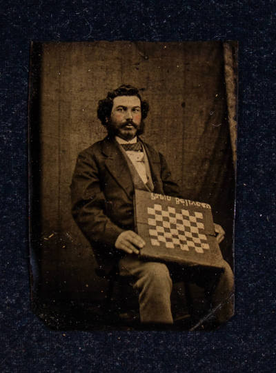 Artist unidentified, “Untitled [Man with a gameboard]”, United States, 1863–1865, Tintype, 4 3/…