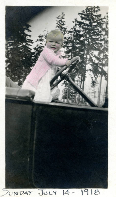 Photographer unidentified, “Untitled [Baby posed with a car's steering wheel]”, United States, …