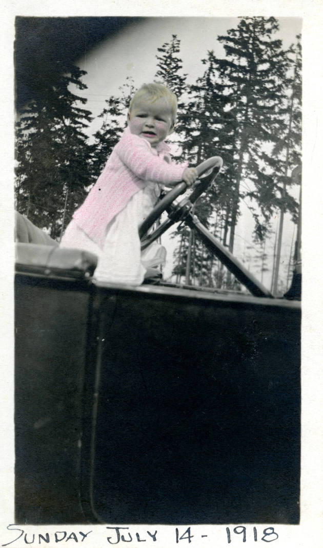 Photographer unidentified, “Untitled [Baby posed with a car's steering wheel]”, United States, …